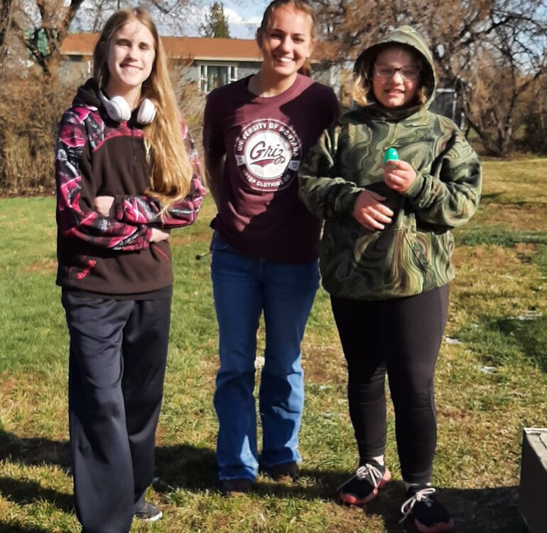 T-Mates, Savannah, Abby, and Jordan, posing after the Easter egg hunt before Easter Break.